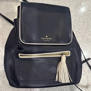 Kate spade navy with white piping leather backpack.